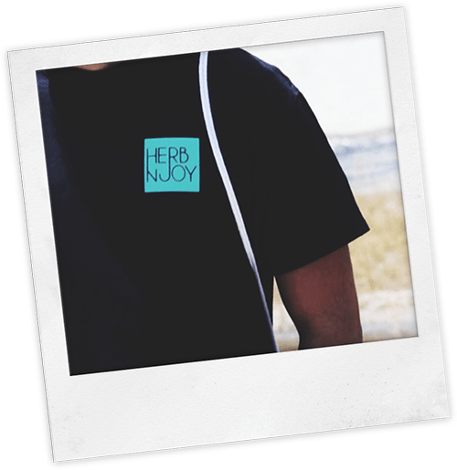 man wearing black HerbNJoy tee shirt